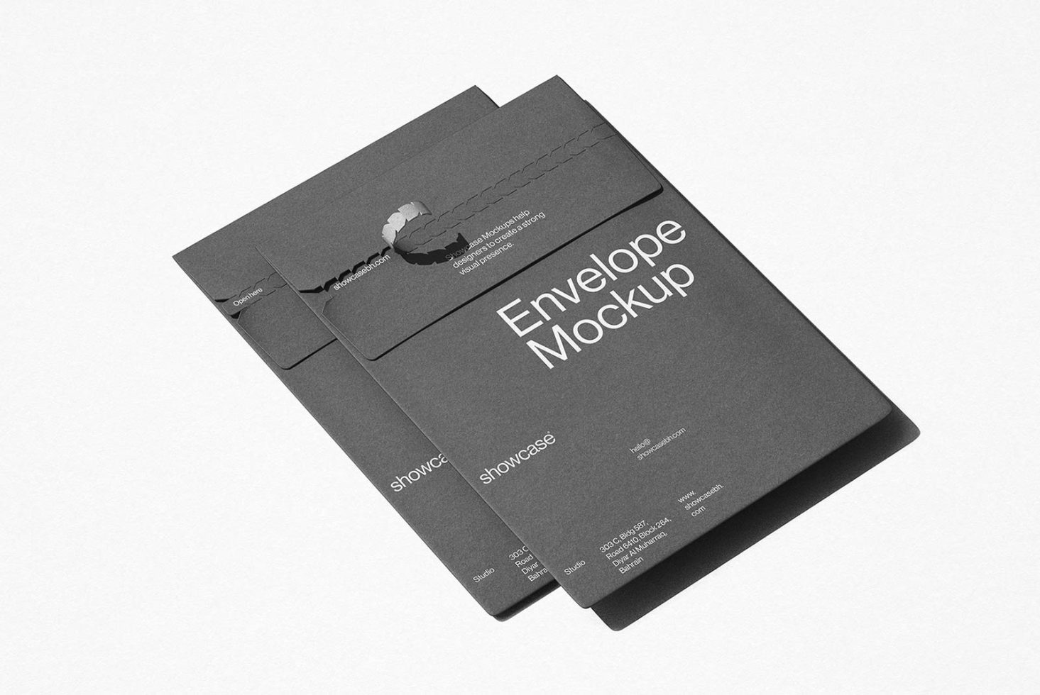 Elegant black envelope mockup lying on a white surface, perfect for designers to showcase branding and stationery designs.